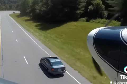 Watch a Badass Pilot Dodge Cars to Land on Curvy Highway